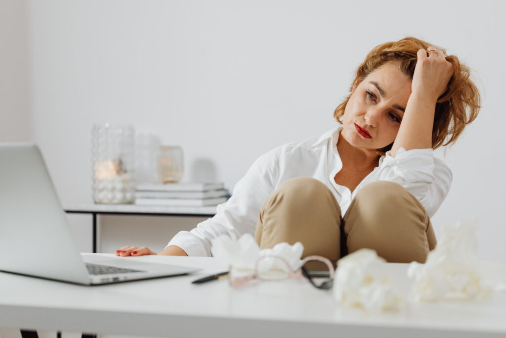 canva sick woman working on laptop